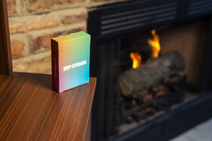 SipStack party game deck by fireplace